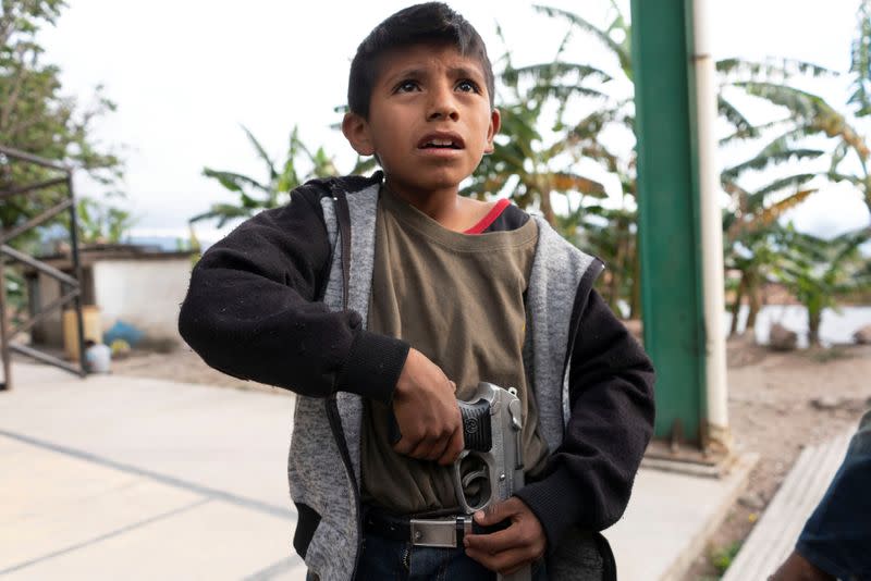 The Wider Image: "Under siege": Inside Mexican village where children are armed