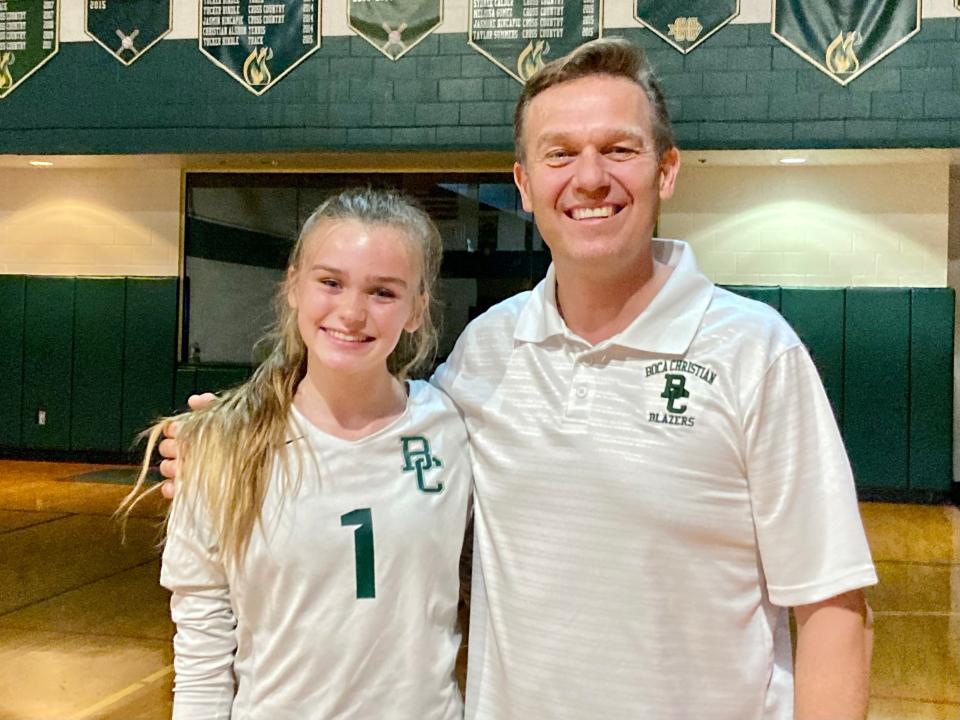 Tekoa Barnes' mini-me, Bradee Boyd, stands with Blazers head coach Len Visser after a three-set sweep in October over Lake Worth Christian.