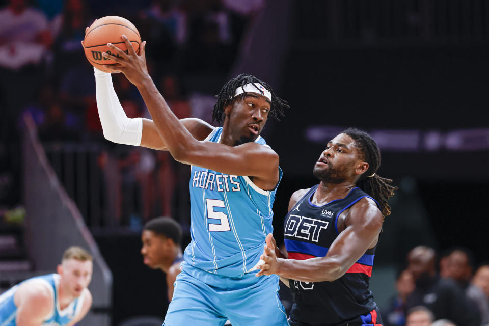 Charlotte Hornets center Mark Williams (5) keeps the ball from Detroit Pistons center Isaiah Stewart during the first quarter of an NBA basketball game in Charlotte, N.C., Friday, Oct. 27, 2023. (AP Photo/Nell Redmond)