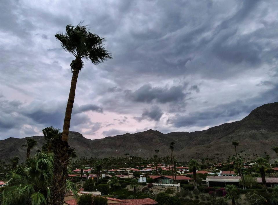 Storm clouds clear the mountains ahead of the anticipated arrival of Hurricane Hilary in Rancho Mirage, Calif., Saturday, Aug. 19, 2023. 