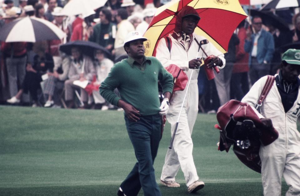 Lee Elder walks down the fairway at Augusta in 1975. (Photo by Augusta National/Getty Images)