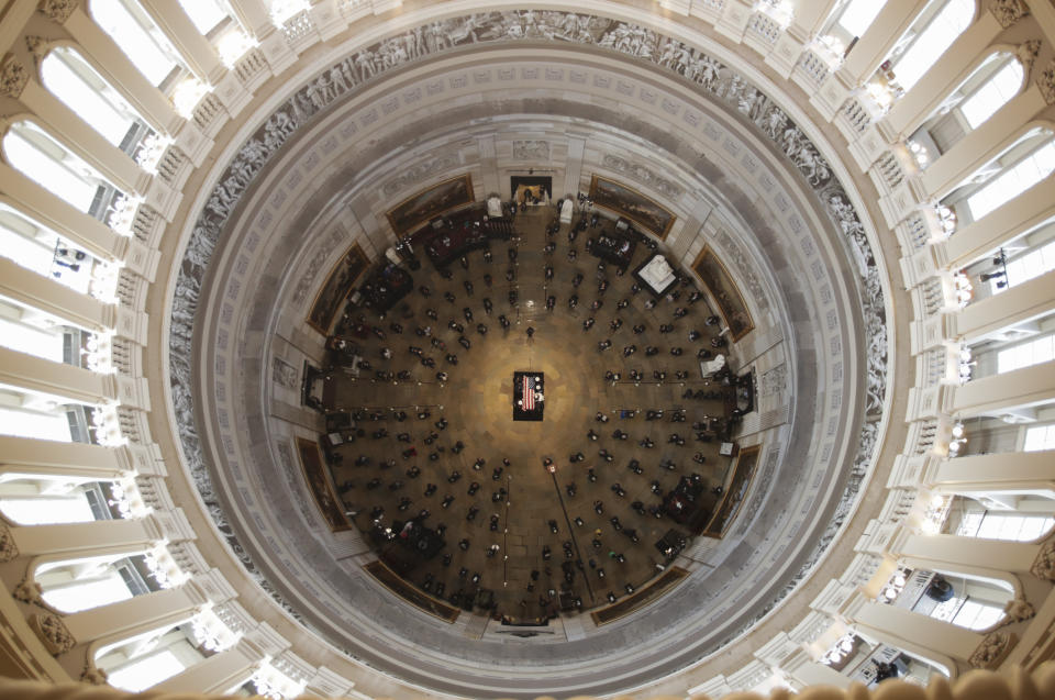 The flag-draped casket of civil rights pioneer Rep. John Lewis, D-Ga., who died July 17, is placed by a U.S. military honor guard at the center of the U.S. Capitol Rotunda to lie in state in Washington, Monday, July 27, 2020. (Jonathan Ernst/Pool Photo via AP)