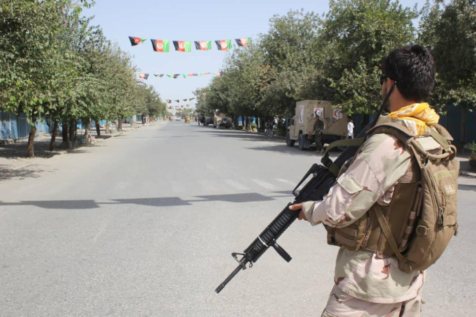 Afghan security forces stand guard during a fight against Taliban fighters in Kunduz province north of Kabul, Afghanistan, Saturday, Aug. 31, 2019. The Taliban have launched a new large-scale attack on one of Afghanistan's main cities, Kunduz, and taken hospital patients as hostages, the government said Saturday, even as the insurgent group continued negotiations with the United States on ending America's longest war. (AP Photo/Bashir Khan Safi)