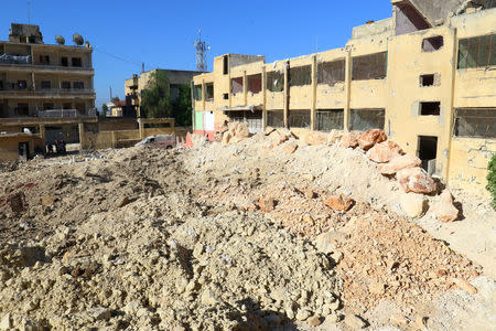 A general view shows the damage at a hospital and its surroundings after an overnight airstrike, in Kafr Takharim, northwest of Idlib city, Syria April 25, 2017. REUTERS/Ammar Abdullah