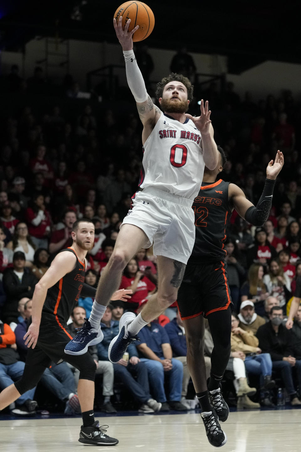 Saint Mary's guard Logan Johnson (0) shoots against Pacific during the first half of an NCAA college basketball game in Moraga, Calif., Thursday, Feb. 23, 2023. (AP Photo/Godofredo A. Vásquez)