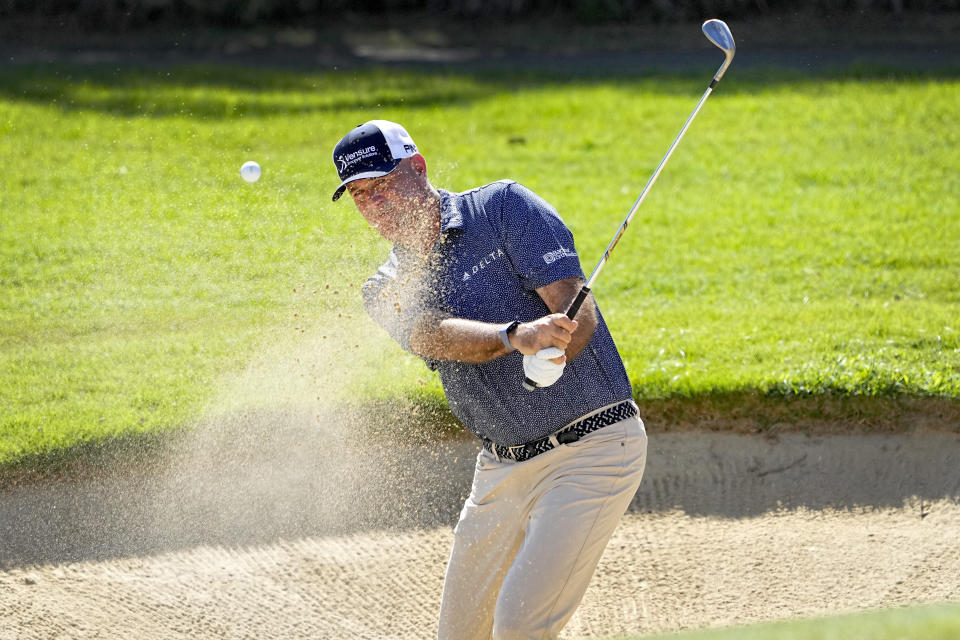 Stewart Cink hits out of the bunker on the first green during the third round of the Sony Open golf event, Saturday, Jan. 13, 2024, at Waialae Country Club in Honolulu. (AP Photo/Matt York)