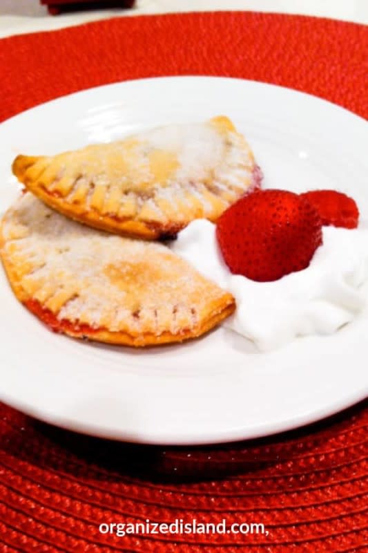 <p>Organized Island</p><p> A delicious hand-held dessert that's made with fresh strawberries and only four ingredients.</p><p><strong>Get the recipe:</strong> <a href="https://www.organizedisland.com/strawberry-empanadas-recipe/" rel="nofollow noopener" target="_blank" data-ylk="slk:Strawberry Empanadas Recipe;elm:context_link;itc:0;sec:content-canvas" class="link rapid-noclick-resp">Strawberry Empanadas Recipe</a></p>