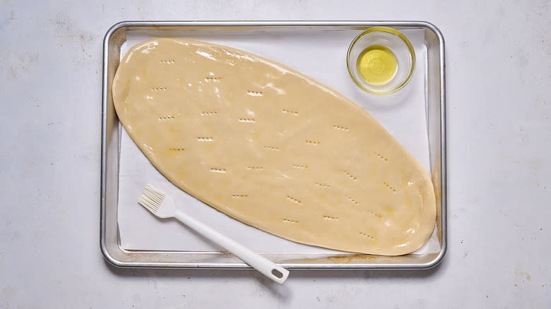 brushing flatbread with oil