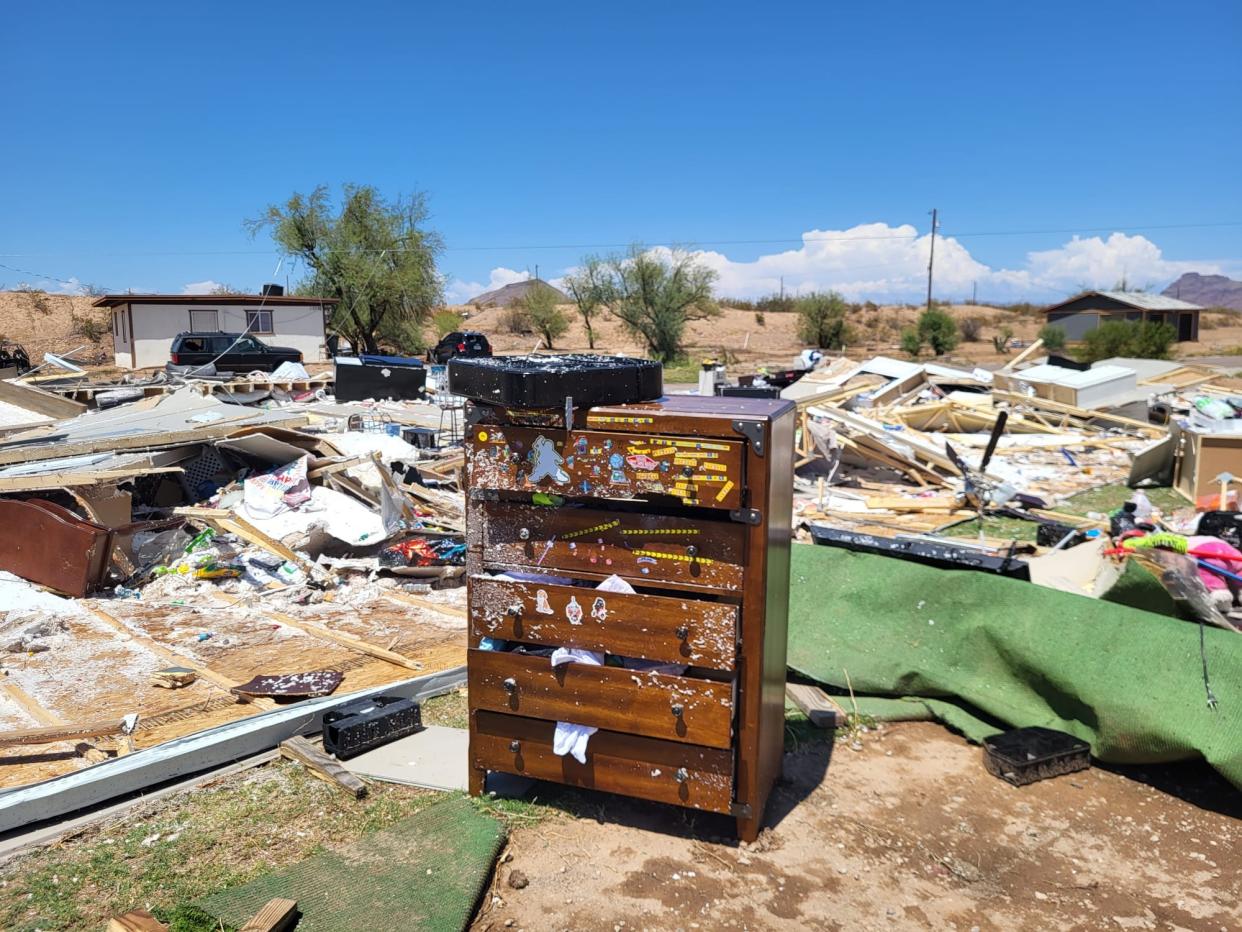 Suzette García's drawer cabinet stands amid rubble from her destroyed mobile home in south Scottsdale