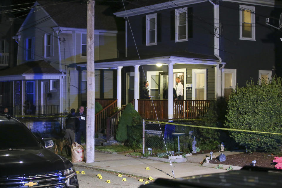 Providence Police investigate a shooting on Carolina Avenue, late Thursday, May 13, 2021, in Providence, R.I. (AP Photo/Stew Milne)