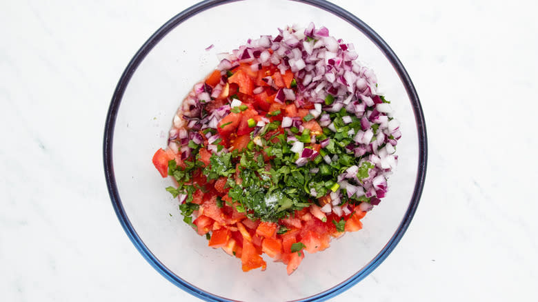 Salsa ingredients in a mixing bowl