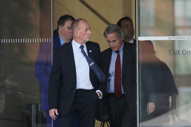 British cave diver Vernon Unsworth emerges from court with attorneys after a U.S. District Court jury found Tesla Inc chief executive Elon Musk not liable for damages, in Los Angeles