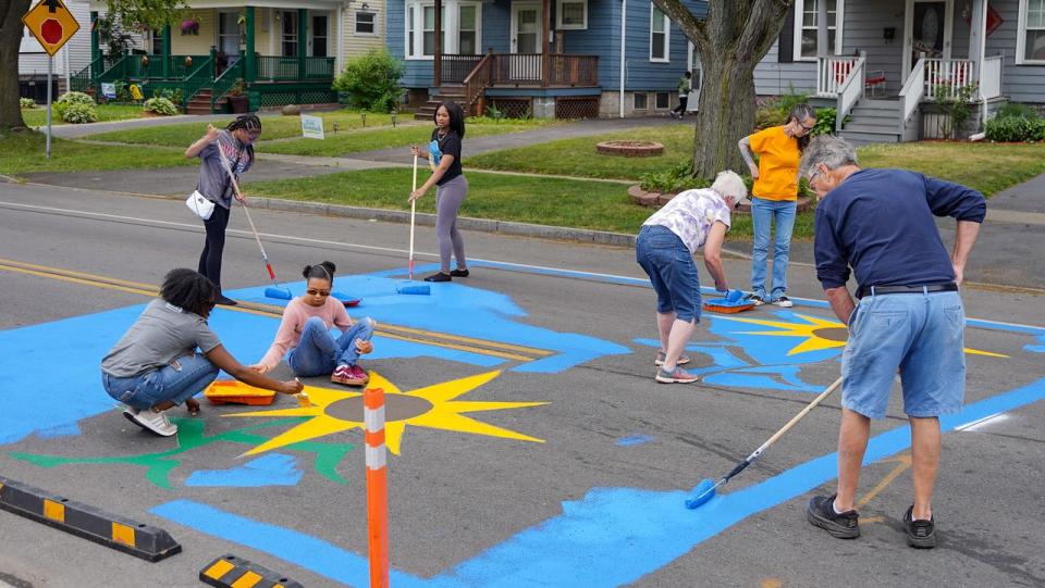 In June, Reconnect Rochester gathered neighbors and community advocates to install traffic calming measures like curb bump outs and street murals at the intersection of Arnett Boulevard and Warwick Avenue in Rochester's 19th Ward.