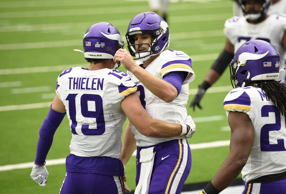 Minnesota Vikings wide receiver Adam Thielen (19) and Minnesota Vikings quarterback Kirk Cousins (8) celebrate after they conned on a pass for a touchdown against the Houston Texans during the second half of an NFL football game Sunday, Oct. 4, 2020, in Houston. (AP Photo/Eric Christian Smith)