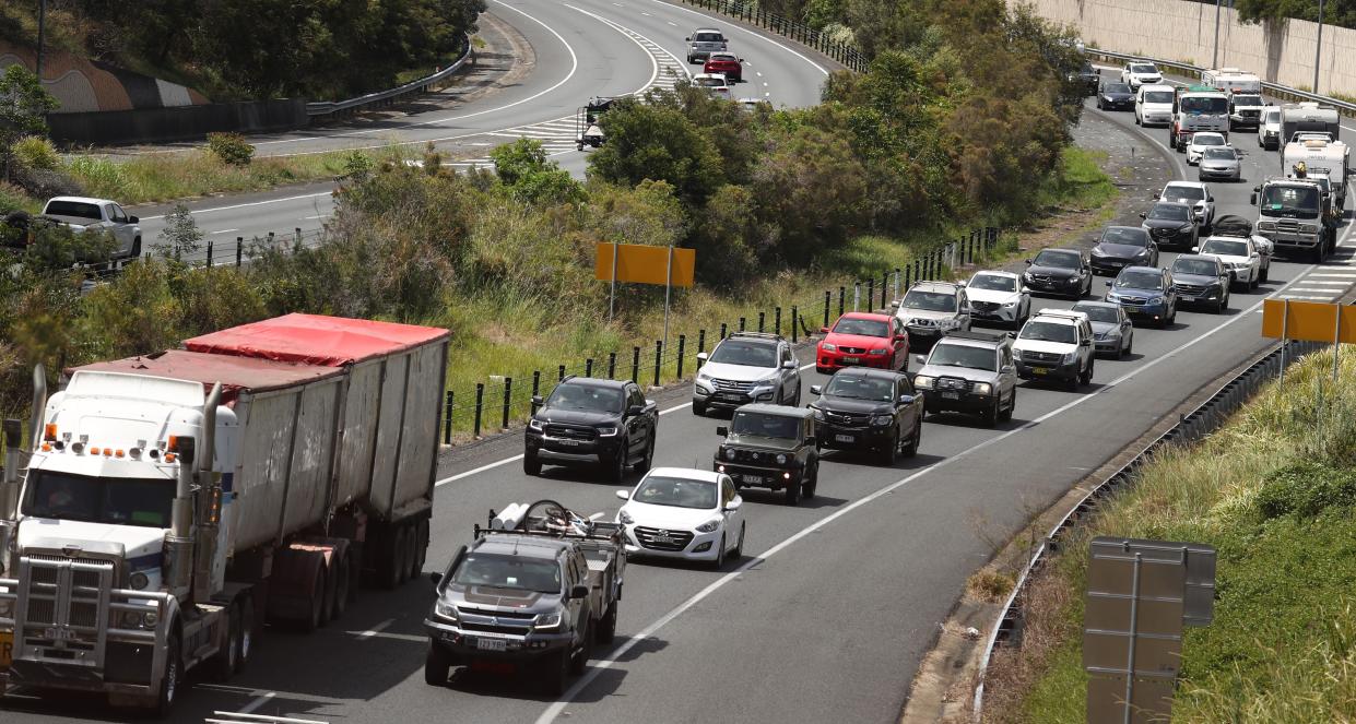 Traffic congestion is seen on the Pacific motorway at Currumbin on the Gold Coast as the Queensland Government announced a 20 per cent cut on car regos.