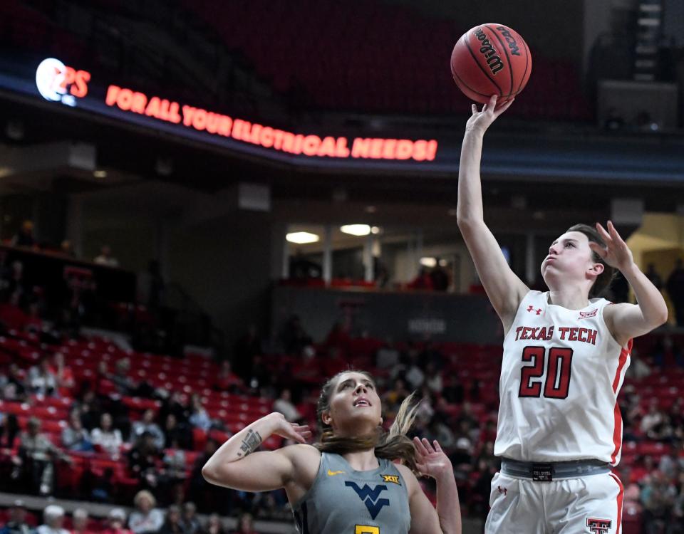 Texas Tech's guard Bailey Maupin (20) shoots the ball against West Virginia in a Big 12 women's basketball game, Wednesday, Feb. 22, 2023, at United Supermarkets Arena.
