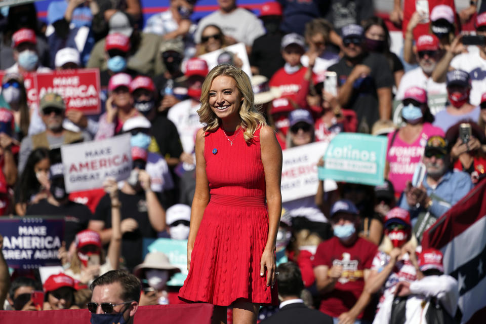 White House press secretary Kayleigh McEnany stands on stage at a campaign rally with President Donald Trump at Prescott Regional Airport, on Oct. 19, 2020, in Prescott, Arizona.  / Credit: Alex Brandon / AP