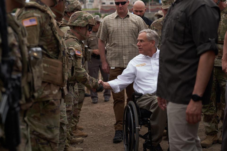 Texas Gov. Greg Abbott tours the U.S.-Mexico border in Eagle Pass in May 2022. <a href="https://www.gettyimages.com/detail/news-photo/texas-governor-greg-abbott-tours-the-us-mexico-border-at-news-photo/1240862283?adppopup=true" rel="nofollow noopener" target="_blank" data-ylk="slk:Allison Dinner/AFP via Getty Images;elm:context_link;itc:0;sec:content-canvas" class="link ">Allison Dinner/AFP via Getty Images</a>
