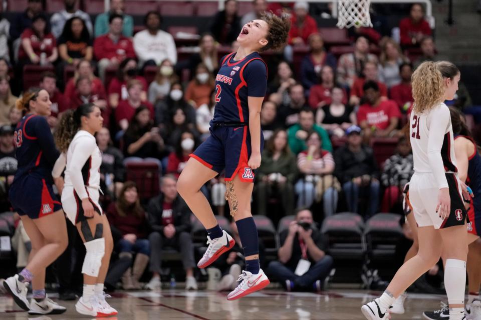 Arizona guard Jada Williams (middle) celebrates during the second half of the team's NCAA college basketball game against Stanford in Stanford, California, on Feb. 23, 2024.