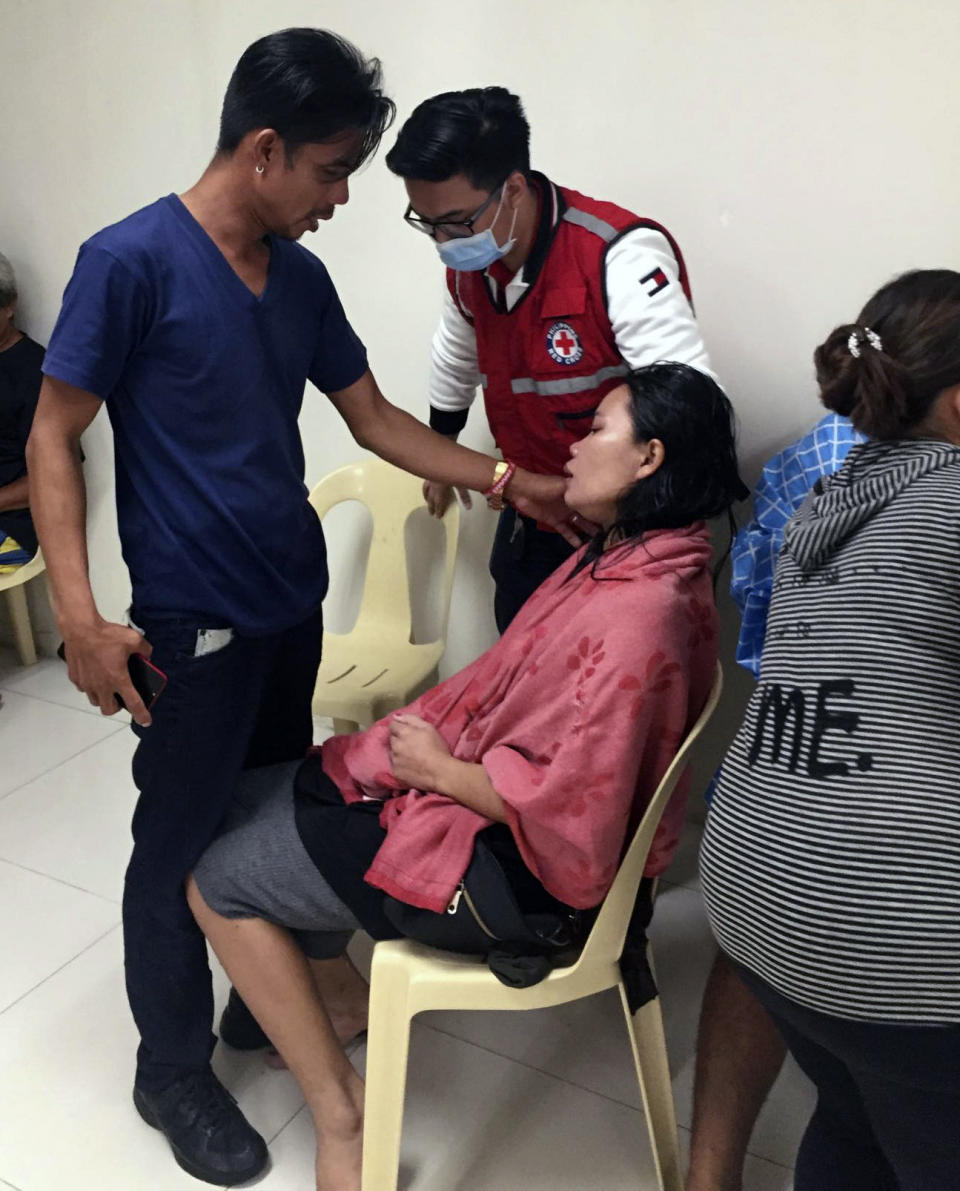 In this photo provided by the Philippine Red Cross, a survivor takes a rest after their ferry boat capsized due to bad weather in the waters between Guimaras and Iloilo provinces, central Philippines on Saturday Aug. 3, 2019. Several people died and 31 others were rescued when three ferry boats separately capsized in bad weather Saturday between two central Philippine island provinces, the coast guard said. (Philippine Red Cross via AP)