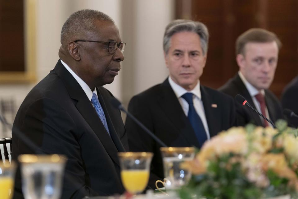 Secretary of Defense Lloyd Austin, left, accompanied by Secretary of State Antony Blinken, center, speaks during a bilateral meeting with Philippines Foreign Affairs Secretary Enrique Manalo at Department of State in Washington, Friday April 12, 2024. (AP Photo/Jose Luis Magana)