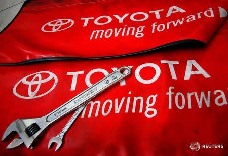 Spanners are placed on a mat by mechanics for the photographer inside a Toyota service centre in Taipei March 3, 2010. REUTERS/Nicky Loh/File Photo