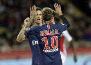 PSG's Neymar celebrates with teammate Edinson Cavani after scoring his side's forth goal during the French League One soccer match between AS Monaco and Paris Saint-Germain at Stade Louis II in Monaco, Sunday, Nov. 11, 2018 (AP Photo/Claude Paris)