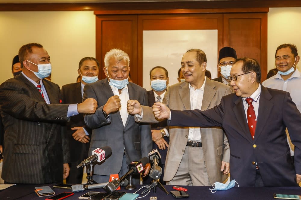 (From left) PBS secretary-general Jahid Jahim, Sabah BN chairman and Umno chief Datuk Seri Bung Moktar Radin, Sabah Bersatu chief Datuk Hajiji Noor and STAR president Datuk Jeffrey Kitingan pose for a photo after the press conference at Hotel Magellan in Kota Kinabalu September 28, 2020. — Picture by Firdaus Latif