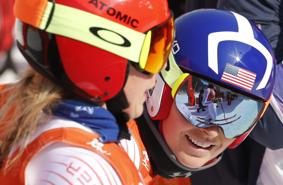 FILE - United States' Lindsey Vonn, right, chats with United States' Mikaela Shiffrin after women's downhill training at the 2018 Winter Olympics in Jeongseon, South Korea, Tuesday, Feb. 20, 2018. Mikaela Shiffrin has matched Lindsey Vonn’s women’s World Cup skiing record with her 82nd win at the women's World Cup giant slalom race, in Kranjska Gora, Slovenia, on Sunday, Jan. 8, 2023. (AP Photo/Cristophe Ena, File)