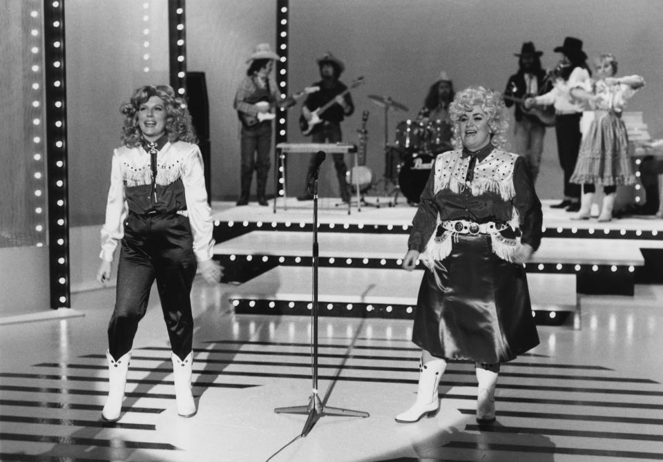 Comic actors Jennifer Saunders (left) and Dawn French dressed as county music singers in a sketch from the television comedy show 'French and Saunders', February 14th 1988. (Photo by Don Smith/Radio Times/Getty Images)