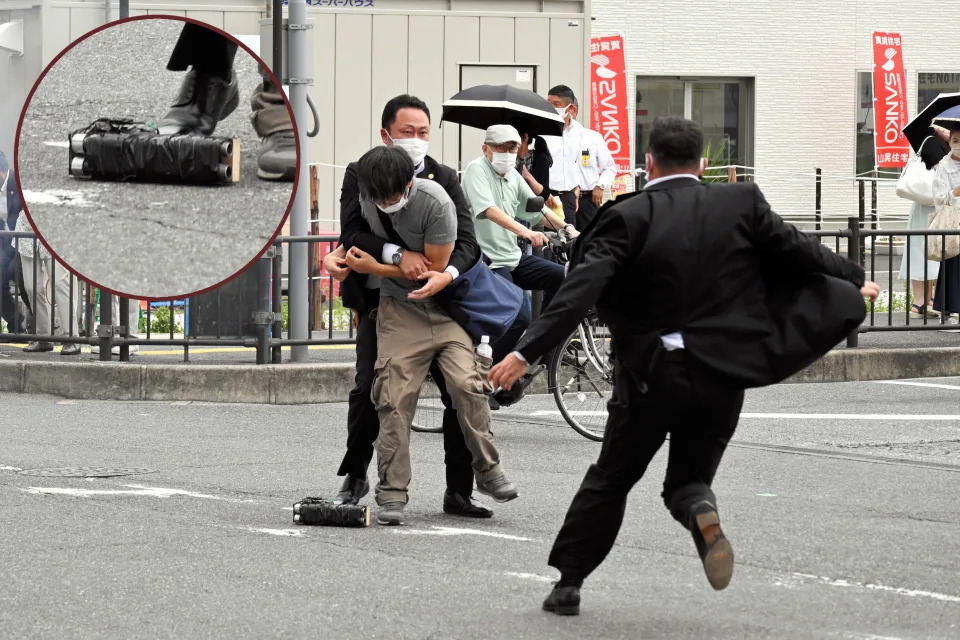 Security officers arrest the suspect in the fatal shooting of former Prime Minister Shinzo Abe in Nara, Japan, on Friday; inset shows a close-up image of the apparent weapon used in the killing. (Photo illustration: Yahoo News; photos: The Asahi Shimbun via Getty Images)