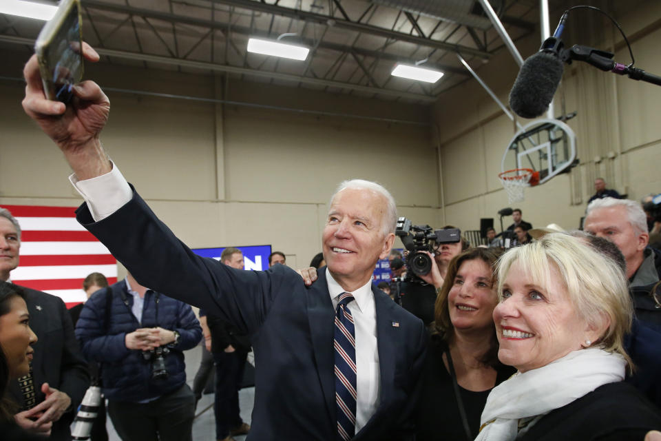 Democratic presidential candidate former Vice President Joe Biden takes a selfie during a campaign event Thursday, Jan. 30, 2020, in Waukee, Iowa. (AP Photo/Sue Ogrocki)