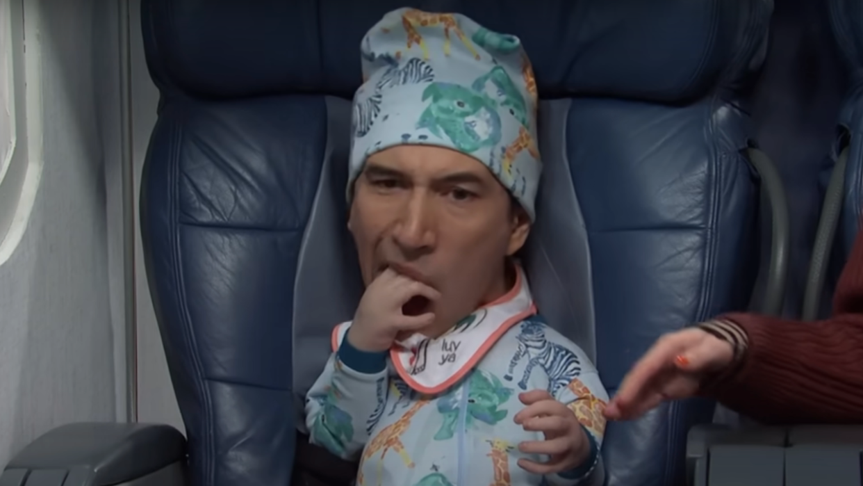  Adam Driver tries to eat his hand while dressed as a baby during an SNL sketch. 