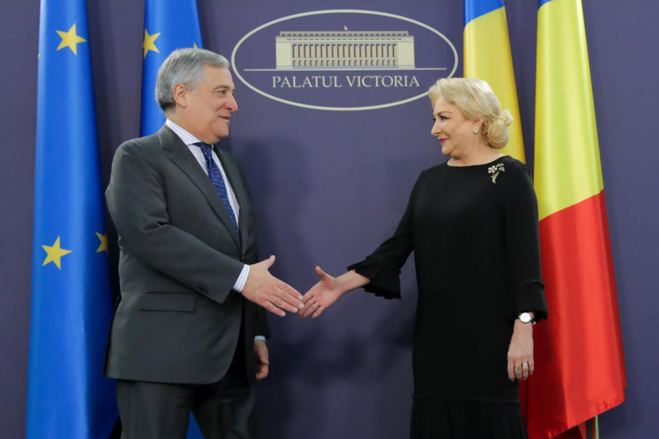 European Parliament President Antonio Tajani, left, shakes hands with Romanian Prime Minister Viorica Dancila at the Victoria Palace in Bucharest, Romania, Wednesday, Nov. 21, 2018. (AP Photo/Vadim Ghirda)