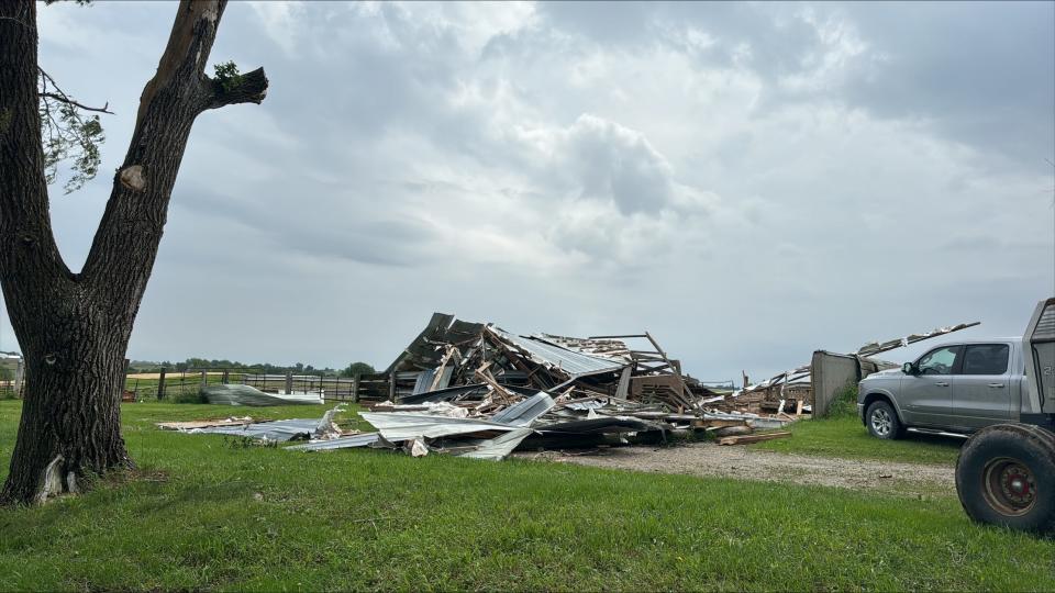 The wreckage of Rick Brenneman’s barn near 540th Street SW and Angle Road SW, south of Frytown, Iowa, on Friday, May 24, 2024. Brenneman found the cows and calves inside the barn alive after sifting through the remains of the barn.