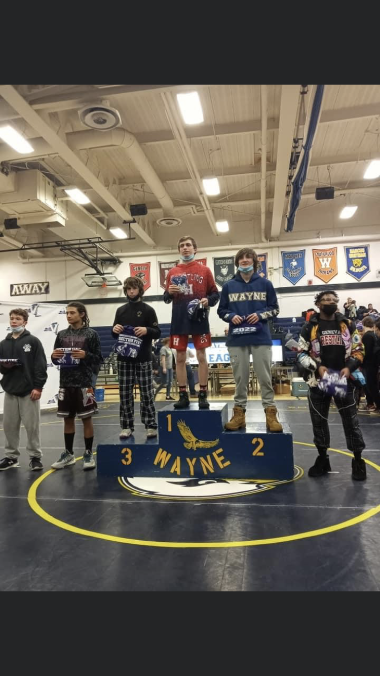 Hornell's Mason Drew stands atop the podium after his stellar Section V Championship run.