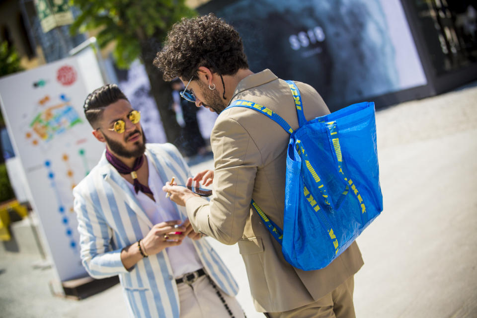 FLORENCE, ITALY - JUNE 13:  Guest wears a Ikea backpack during Pitti Immagine Uomo 92. at Fortezza Da Basso on June 13, 2017 in Florence, Italy.  (Photo by Claudio Lavenia/Getty Images)