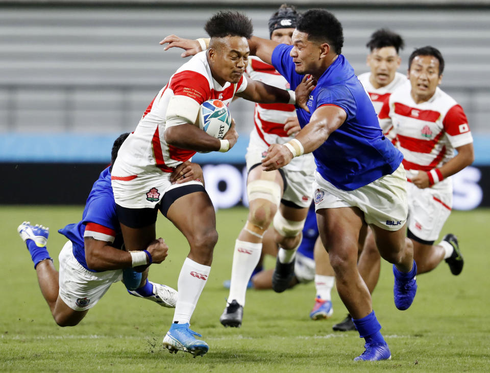 Japan's Kotaro Matsushima runs at the Samoan defence during the Rugby World Cup Pool A game at City of Toyota Stadium between Japan and Samoa in Tokyo City, Japan, Saturday, Oct. 5, 2019./Kyodo News via AP)