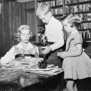 <p>While in the study of her Los Angeles home, Lauren Bacall sorts through papers with her children, Stephen and Leslie. </p>