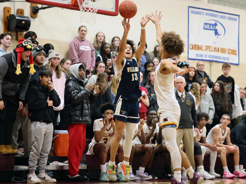 Arhbishop Williams Tristan Rodriguez attempts a three point basket over Cardinal Spellman defender D'Anthony Amado during a game on Friday, Jan. 26, 2024.