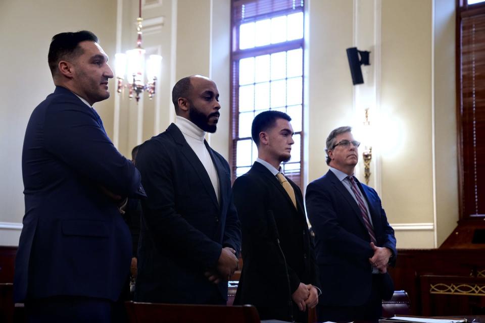 George Rodriguez, second from left, and Jacob Gardner, third from left, are sentenced for street racing in a crash that seriously injured Natasha Legein, the owner of the Crepe Corner restaurant in Pawtuxet Village.