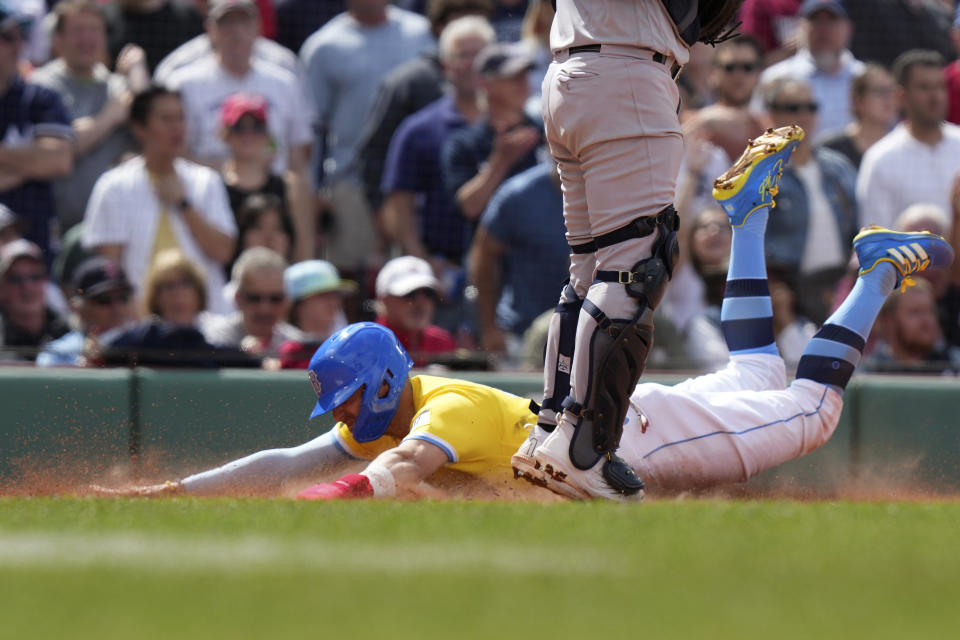 Boston Red Sox's Enrique Hernandez, left, slides safely into home in front of New York Yankees' Jose Trevino, right, to score on a double by Connor Wong in the sixth inning of a baseball game, Sunday, June 18, 2023, in Boston. (AP Photo/Steven Senne)
