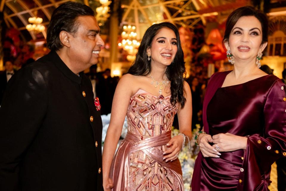 Mukesh Ambani, the Chairman of Reliance Industries, Radhika Merchant and Nita Ambani, share a moment during the pre-wedding celebrations of Anant Ambani and Radhika in Jamnagar, Gujarat, India (Reuters)