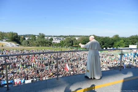 Pope Francis waves as he arrives to the Sanctuary of Divine Mercy in Krakow, Poland July 30, 2016. Osservatore Romano/Handout via Reuters