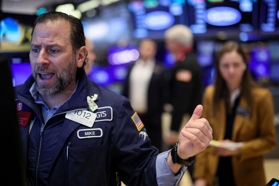 FILE PHOTO: Traders work on the floor at the New York Stock Exchange (NYSE) in New York City, U.S., February 6, 2024.  REUTERS/Brendan McDermid/File Photo