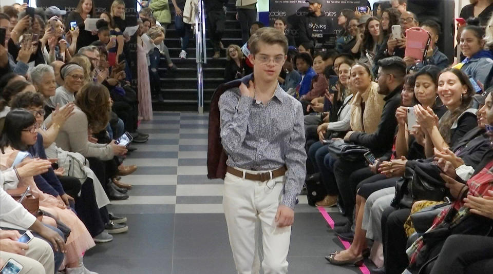 This image from video taken on Wednesday, Oct. 16, 2019 shows a boy participating in the 2nd annual “Gigi’s Playhouse Fashion Show” in New York. Gigi’s Playhouse is an education and achievement center that prepares young people with Down syndrome to engage more fully in their homes, schools and communities. (AP Photo/Gary Gerard Hamilton)