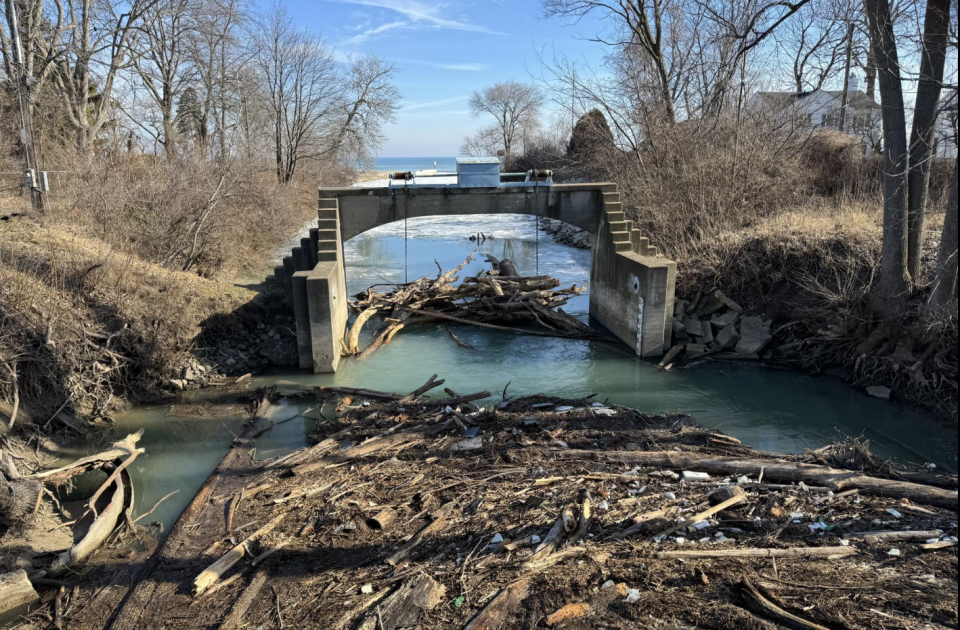 Debris is shown piled up around the Tainter gate structure of the Black River Canal. After the gate was opened to help relieve floodwater pressure on Jan. 27, Port Huron officials said the reverse flow managed to pick up some wooded material heavy enough to pull the gate down.