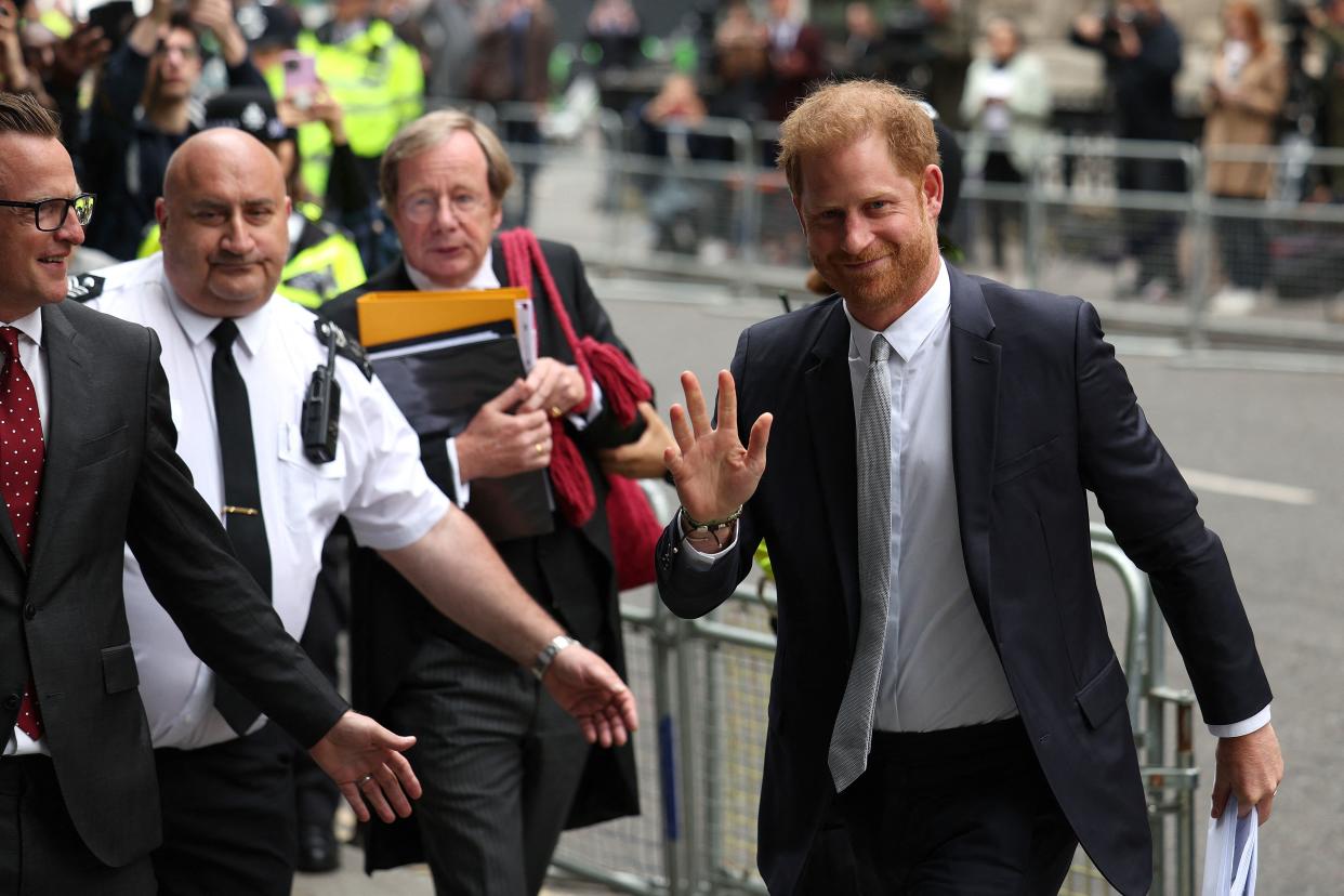 Britain's Prince Harry (R), Duke of Sussex, waves as he arrives to the Royal Courts of Justice, Britain's High Court, in central London on June 7, 2023. Prince Harry testified he had suffered lifelong 