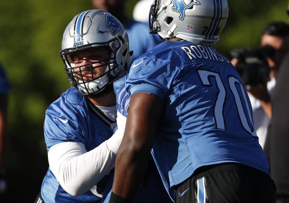 Detroit Lions left tackle Taylor Decker, left, could miss the start of the 2017 season with a shoulder injury. (AP)