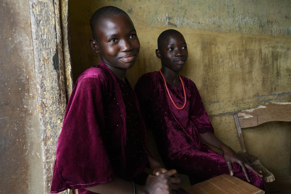 Twins Taiwo Lateef, left, and Kehinde Lateef, 13, from Igbo-Ora town and students of Igbo-Ora grammar secondary school attends the annual twins festival in Igbo-Ora South west Nigeria, Saturday, Oct. 8, 2022. The town holds the annual festival to celebrate the high number of twins and multiple births. (AP Photo/Sunday Alamba)